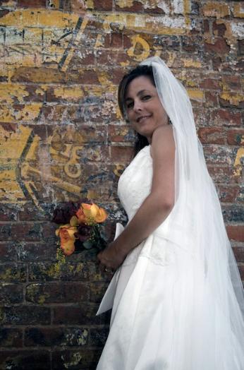 Smiling bride in the back-alleys of Ft. Collins